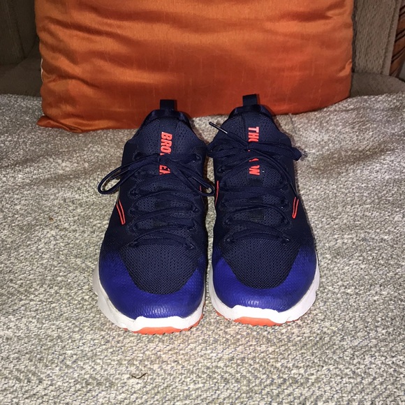 navy and orange turf shoes